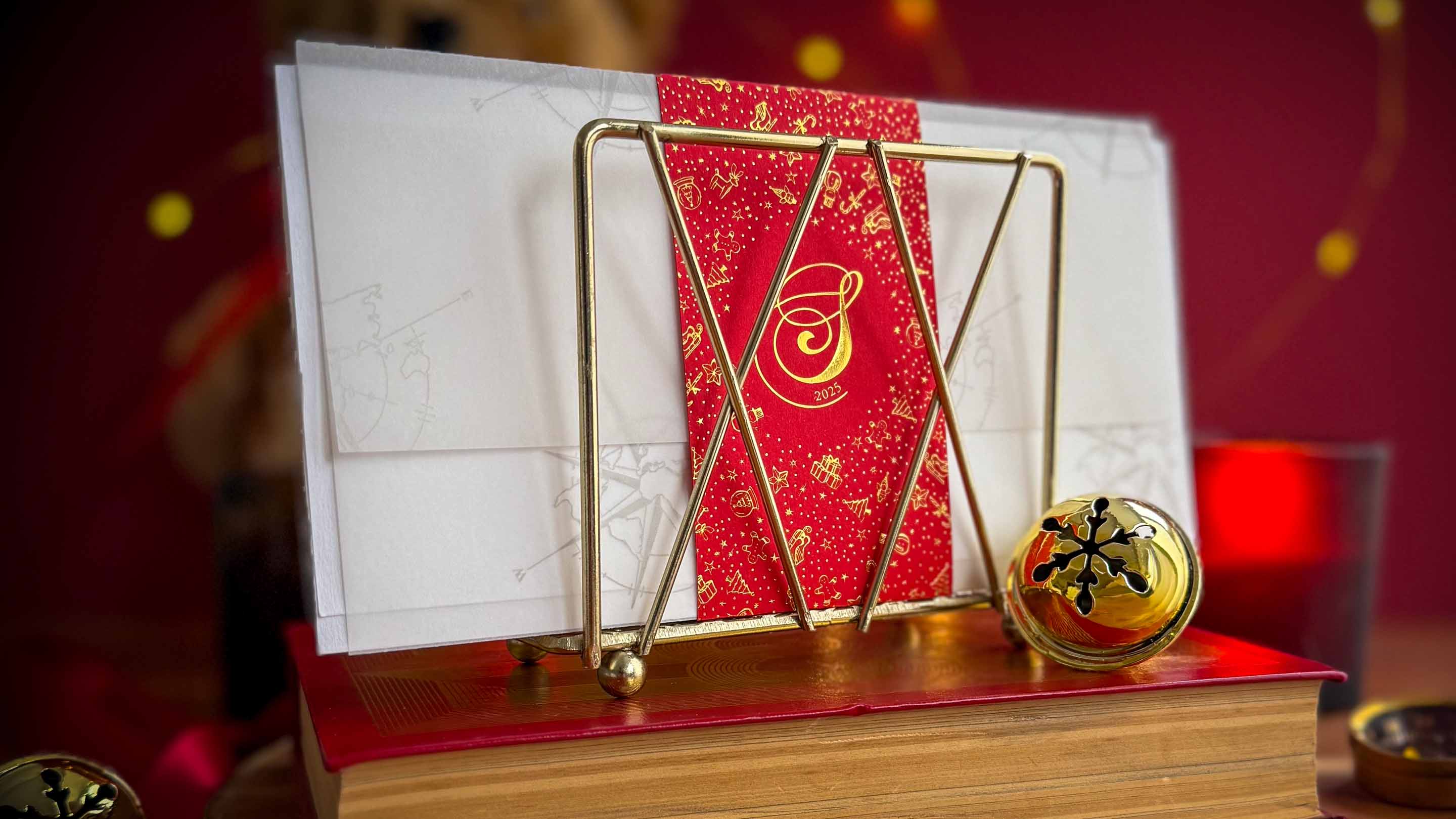 A classic illustration of Santa Claus writing a letter.